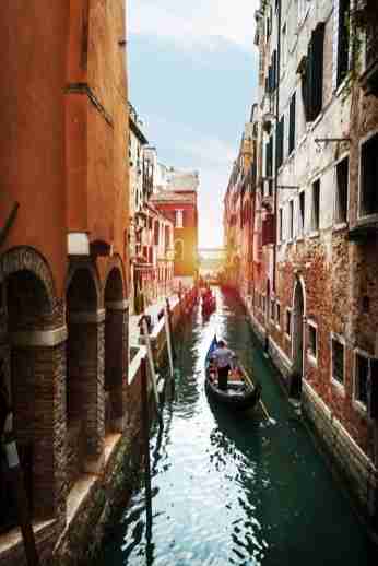 Gondolier in the canals of Venice